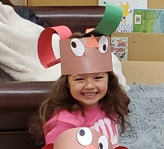 Wearing her turkey hat